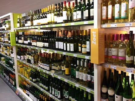 Supermarket shelves ranging wine by flavour profile